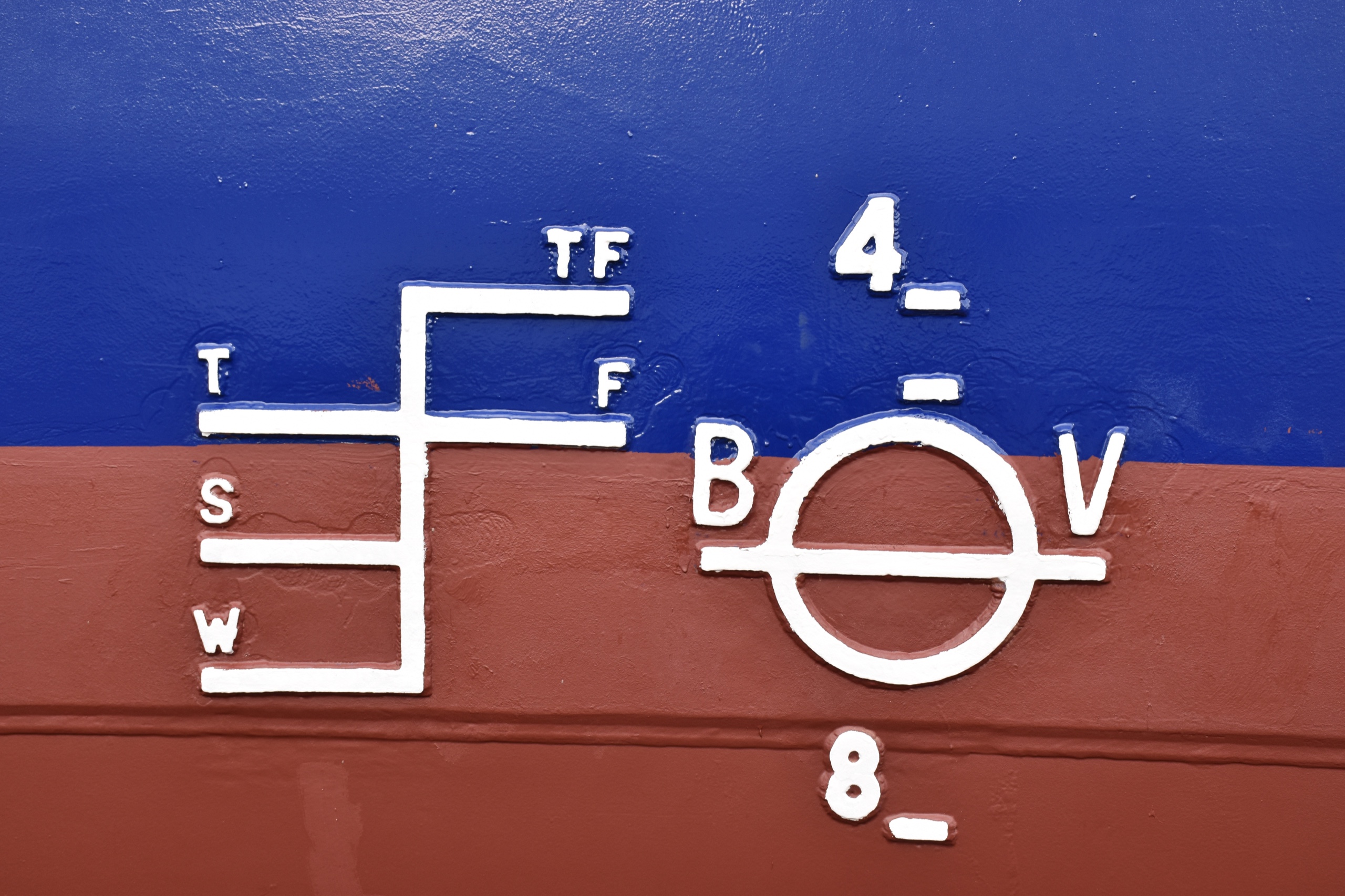 A clean blue ship hull bearing a white International Plimsoll load-line mark at the waterline.